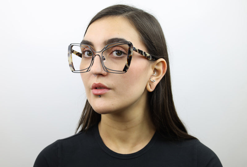 Woman wearing these luxury designer SEE Eyeglasses